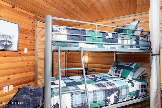 531 Gatlin Dr, Gatlinburg, TN 37738 - bedroom featuring wooden ceiling and wooden walls