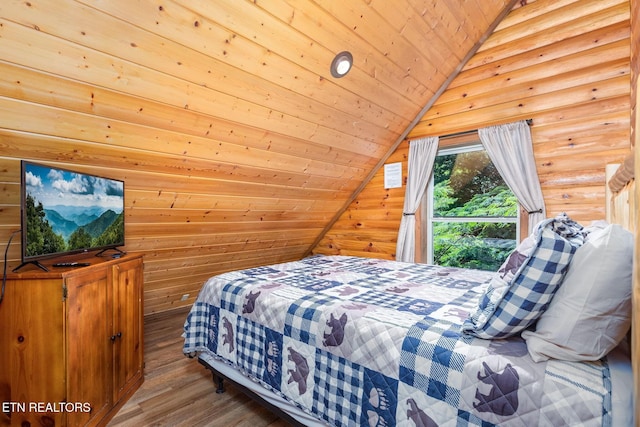 531 Gatlin Dr, Gatlinburg, TN 37738 - bedroom with wooden ceiling, vaulted ceiling, wood finished floors, and wooden walls
