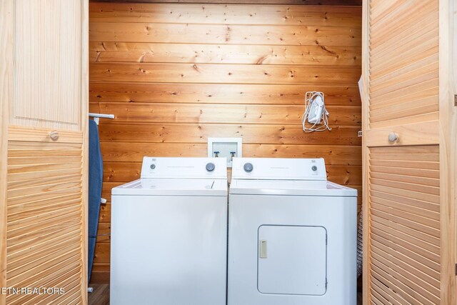 531 Gatlin Dr, Gatlinburg, TN 37738 - laundry room with washing machine and clothes dryer and wood walls