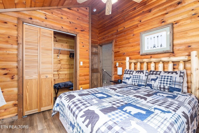 531 Gatlin Dr, Gatlinburg, TN 37738 - bedroom featuring rustic walls, wood finished floors, and a closet