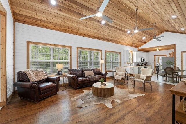 living room with ceiling fan, dark wood-style floors, wooden ceiling, and high vaulted ceiling