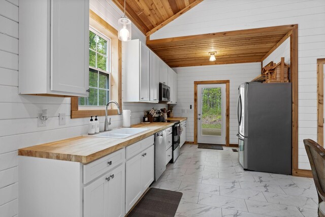 kitchen featuring a sink, wooden ceiling, marble finish floor, lofted ceiling, and stainless steel appliances