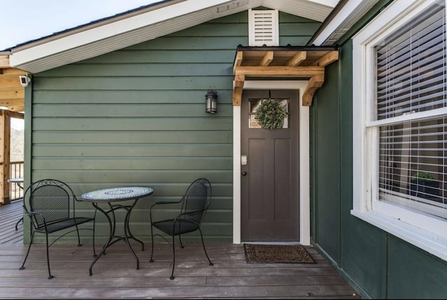 doorway to property featuring a deck