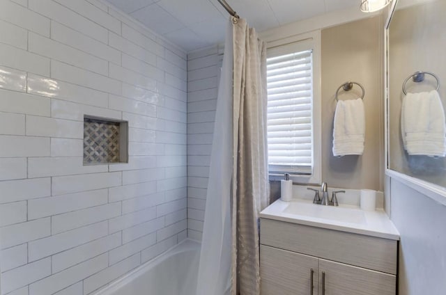 bathroom with vanity and shower / bath combination with curtain