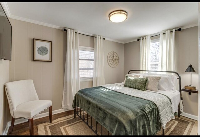 bedroom featuring multiple windows and ornamental molding