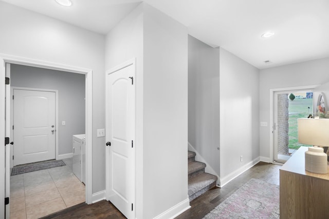 corridor with washing machine and clothes dryer, recessed lighting, and baseboards