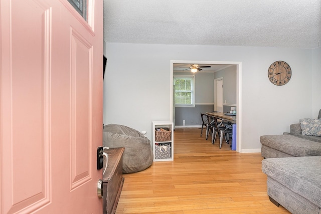 7205 Birchbark Dr, Fairview, TN 37062 - living room with light wood-type flooring, a ceiling fan, and a textured ceiling