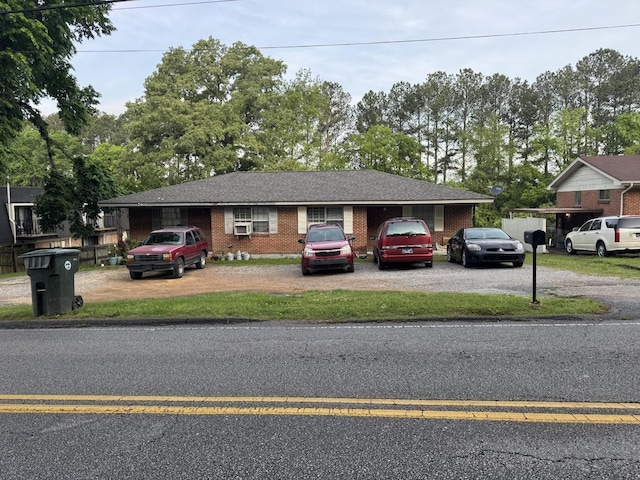 ranch-style home with brick siding and driveway