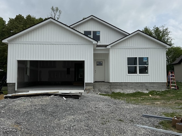 125 Reece Rd, Baxter, TN 38544 - modern farmhouse featuring board and batten siding, driveway, and a garage