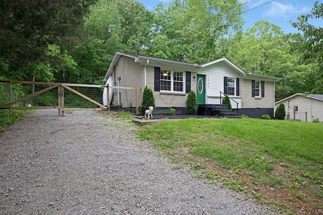 1032 Gordon Cir, Burns, TN 37029 - manufactured / mobile home featuring brick siding and a gate