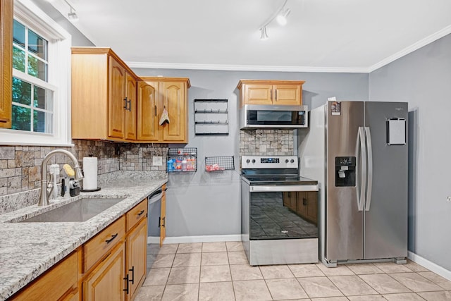 1032 Gordon Cir, Burns, TN 37029 - kitchen featuring appliances with stainless steel finishes, a sink, backsplash, light stone counters, and crown molding