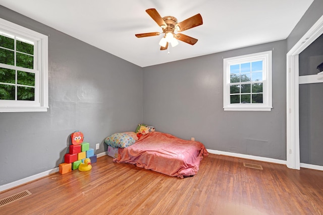 1032 Gordon Cir, Burns, TN 37029 - bedroom with wood finished floors, baseboards, and ceiling fan