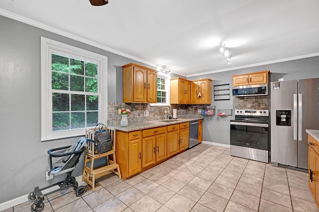1032 Gordon Cir, Burns, TN 37029 - kitchen with appliances with stainless steel finishes, a sink, tasteful backsplash, crown molding, and light stone countertops