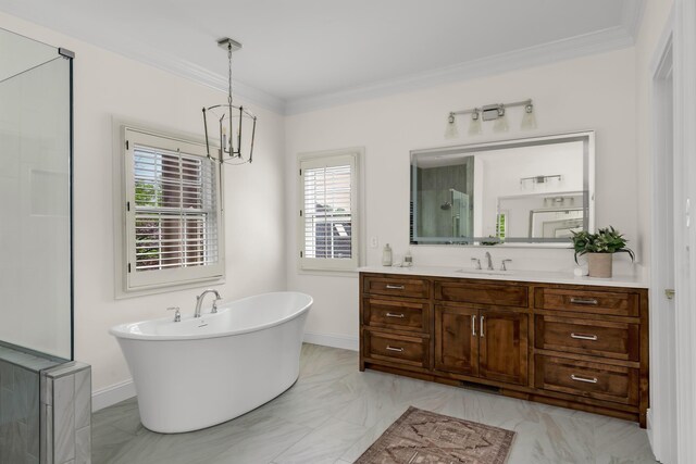 bathroom featuring an inviting chandelier, marble finish floor, crown molding, and a freestanding bath