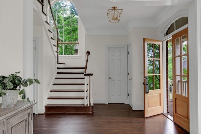entryway featuring stairs, baseboards, and dark wood-type flooring