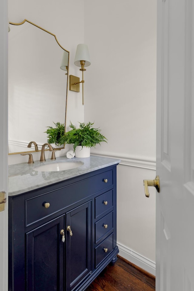 bathroom featuring wood finished floors and vanity