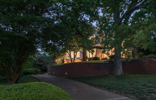 exterior space with a lawn and driveway