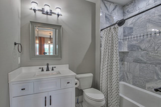 bathroom featuring vanity, shower / bath combo, and toilet