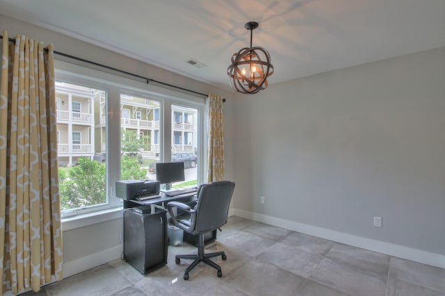 office space with baseboards, visible vents, and an inviting chandelier