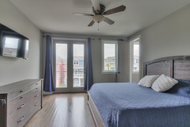 bedroom featuring access to outside, ceiling fan, and light wood-type flooring