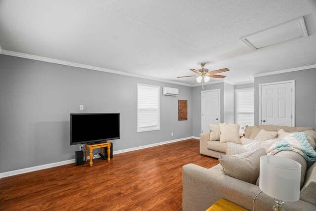 3513 Hunters Rdg, Woodlawn, TN 37191 - living area featuring a wall unit AC, wood finished floors, attic access, ornamental molding, and baseboards