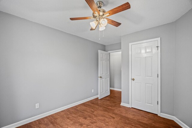 3513 Hunters Rdg, Woodlawn, TN 37191 - unfurnished bedroom with wood finished floors, baseboards, and a ceiling fan