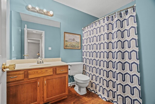 3513 Hunters Rdg, Woodlawn, TN 37191 - bathroom featuring toilet, wood finished floors, vanity, a shower with shower curtain, and a textured ceiling