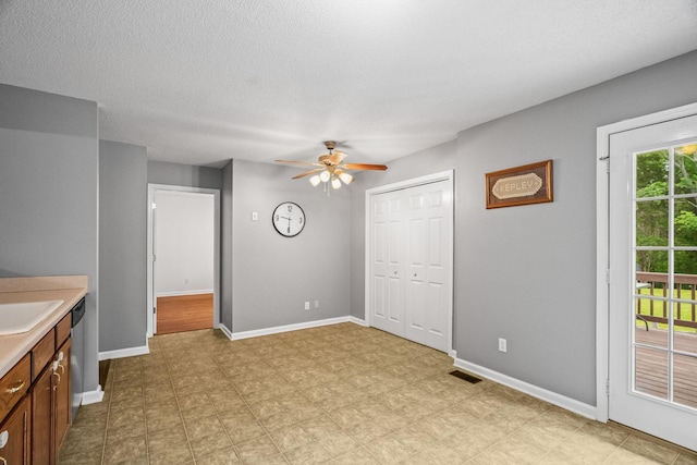 3513 Hunters Rdg, Woodlawn, TN 37191 - unfurnished bedroom featuring access to exterior, a closet, baseboards, light floors, and a textured ceiling