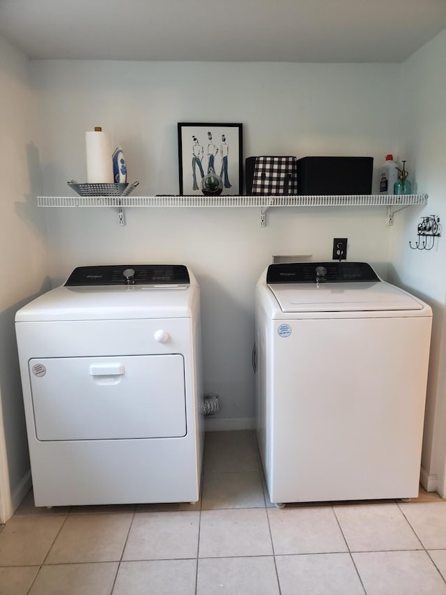 339 Perrolee St, Gallatin, TN 37066 - laundry area with light tile patterned floors, baseboards, laundry area, and washer and dryer