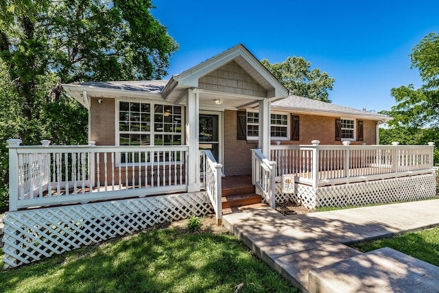 907 N Graycroft Ave, Madison, TN 37115 - ranch-style house with a wooden deck, brick siding, and roof with shingles