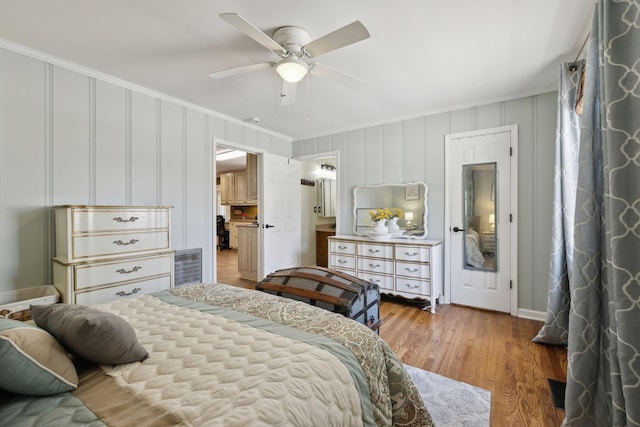 206 Evergreen Dr, Columbia, TN 38401 - bedroom featuring crown molding, light wood-style floors, ceiling fan, and a decorative wall