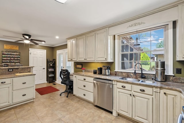 206 Evergreen Dr, Columbia, TN 38401 - kitchen with stainless steel dishwasher, plenty of natural light, a sink, and cream cabinets