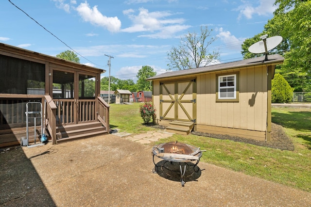 206 Evergreen Dr, Columbia, TN 38401 - view of yard with an outdoor structure, an outdoor fire pit, a sunroom, and a storage unit