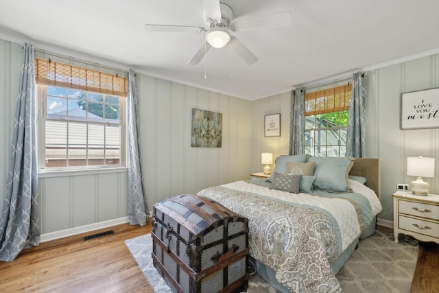 206 Evergreen Dr, Columbia, TN 38401 - bedroom with visible vents, crown molding, a decorative wall, and wood finished floors