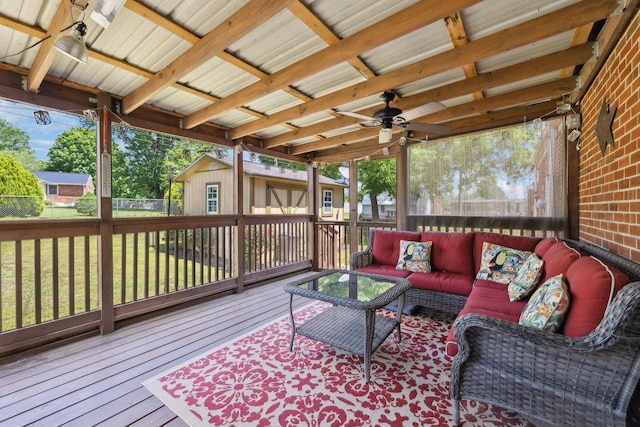 206 Evergreen Dr, Columbia, TN 38401 - deck with fence, outdoor lounge area, an outbuilding, a ceiling fan, and a yard