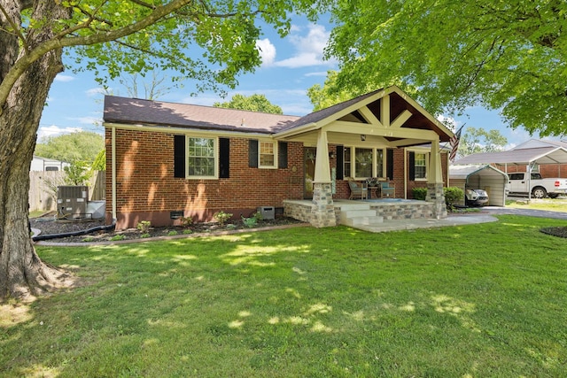 206 Evergreen Dr, Columbia, TN 38401 - view of front of property featuring a front yard, brick siding, crawl space, a porch, and a carport