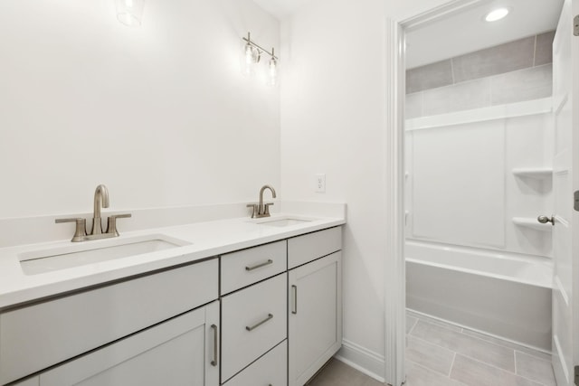 1065 Gholson Rd, Clarksville, TN 37043 - bathroom with a sink, baseboards, tile patterned flooring, and double vanity