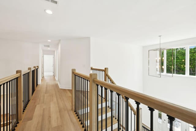 1065 Gholson Rd, Clarksville, TN 37043 - hall featuring visible vents, an inviting chandelier, light wood-style floors, recessed lighting, and an upstairs landing