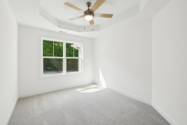 1065 Gholson Rd, Clarksville, TN 37043 - carpeted empty room with a raised ceiling, baseboards, a ceiling fan, and visible vents