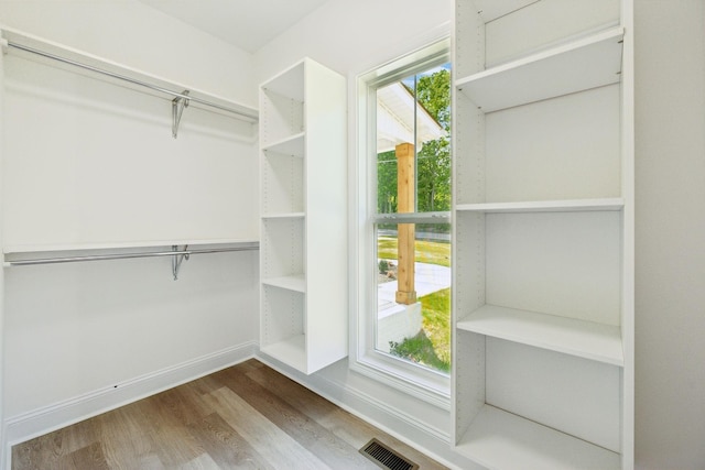 1065 Gholson Rd, Clarksville, TN 37043 - walk in closet featuring wood finished floors and visible vents