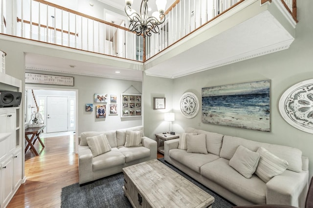 1505 Newmans Trl, Hendersonville, TN 37075 - living area with crown molding, a high ceiling, light wood-style floors, and a chandelier