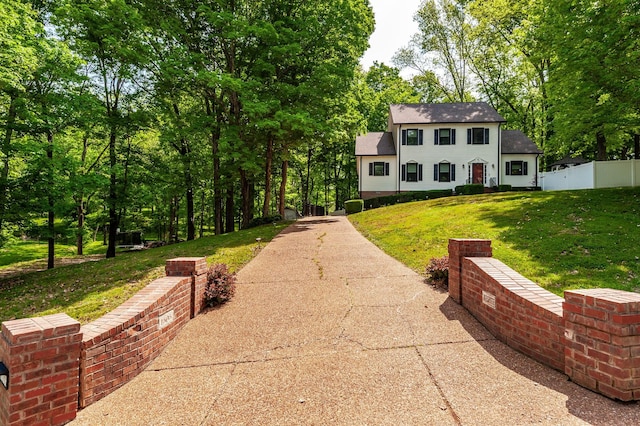 1505 Newmans Trl, Hendersonville, TN 37075 - colonial inspired home featuring a shingled roof, a front lawn, fence, and concrete driveway