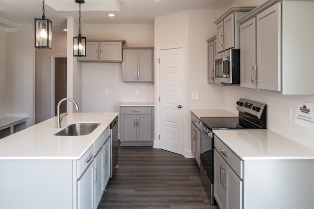 405 Galway Dr, Clarksville, TN 37042 - kitchen featuring appliances with stainless steel finishes, gray cabinets, recessed lighting, dark wood-type flooring, and an island with sink