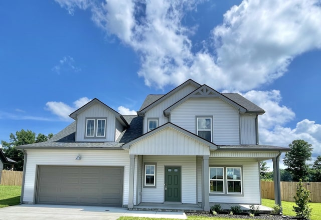 405 Galway Dr, Clarksville, TN 37042 - view of front of house with driveway, a porch, a garage, and a shingled roof