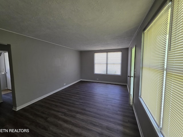 103 S Purdue Ave, Oak Ridge, TN 37830 - empty room with a textured ceiling and dark wood-style floors