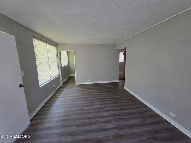 103 S Purdue Ave, Oak Ridge, TN 37830 - unfurnished room with a textured ceiling and dark wood-style floors
