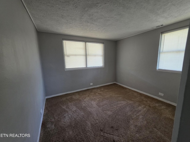 103 S Purdue Ave, Oak Ridge, TN 37830 - empty room with carpet flooring and a textured ceiling