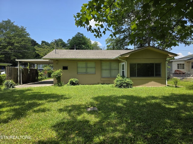 103 S Purdue Ave, Oak Ridge, TN 37830 - rear view of house featuring an attached carport and a shingled roof