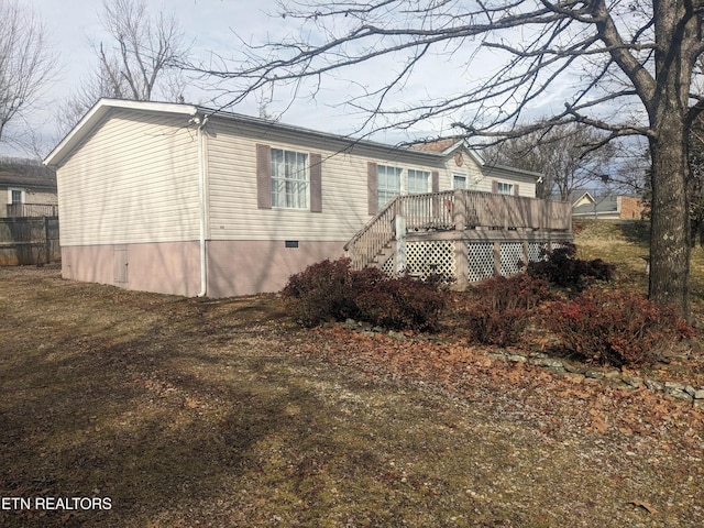 805 N Front St, Rockwood, TN 37854 - view of side of home with a deck, crawl space, and fence