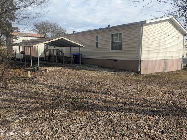 805 N Front St, Rockwood, TN 37854 - back of property with crawl space